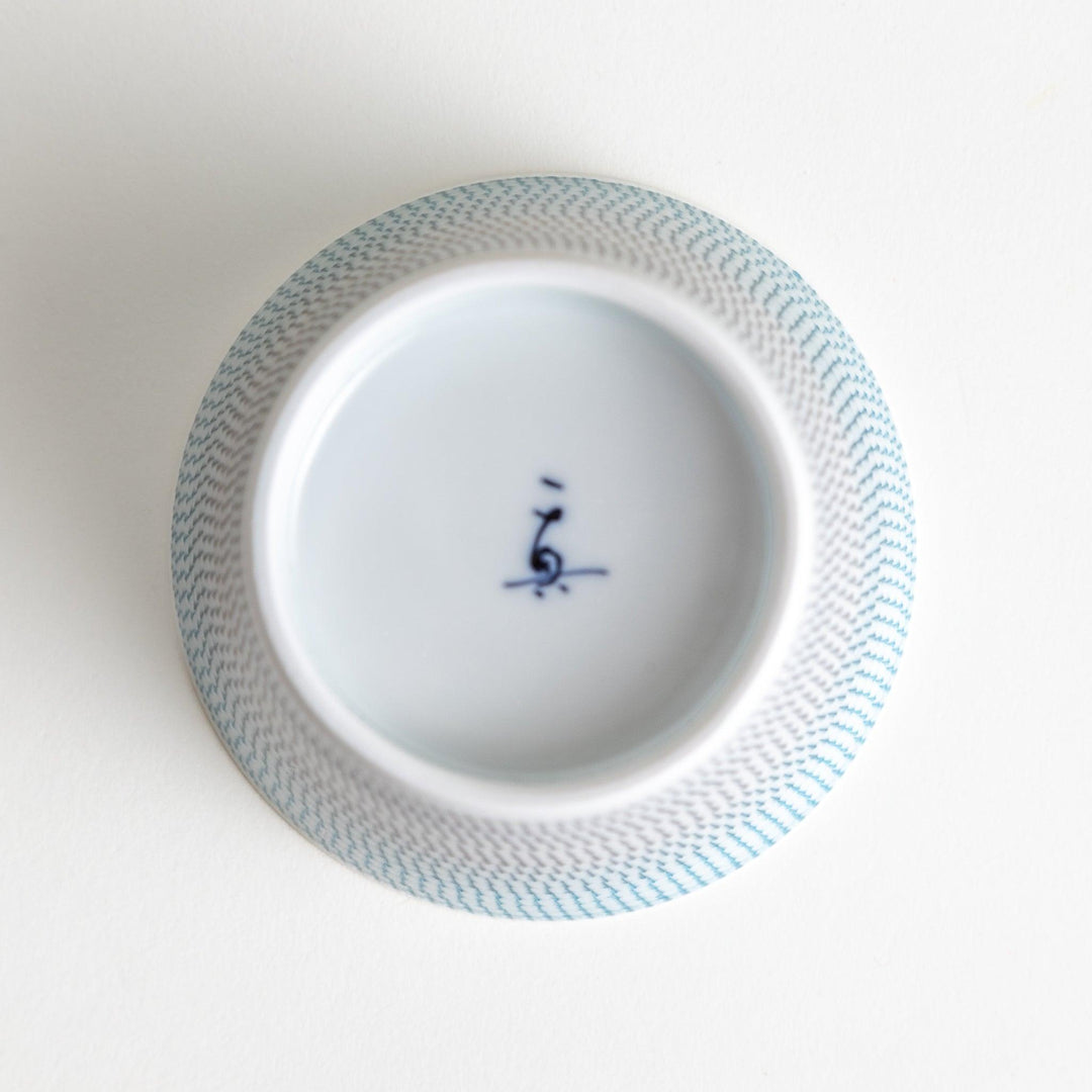 Japanese porcelain dessert bowl with delicate vertical line pattern and smooth gradient design for modern, everyday dining