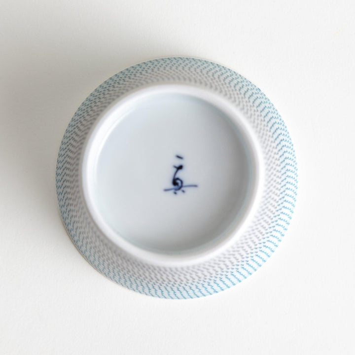 Japanese porcelain dessert bowl with delicate vertical line pattern and smooth gradient design for modern, everyday dining