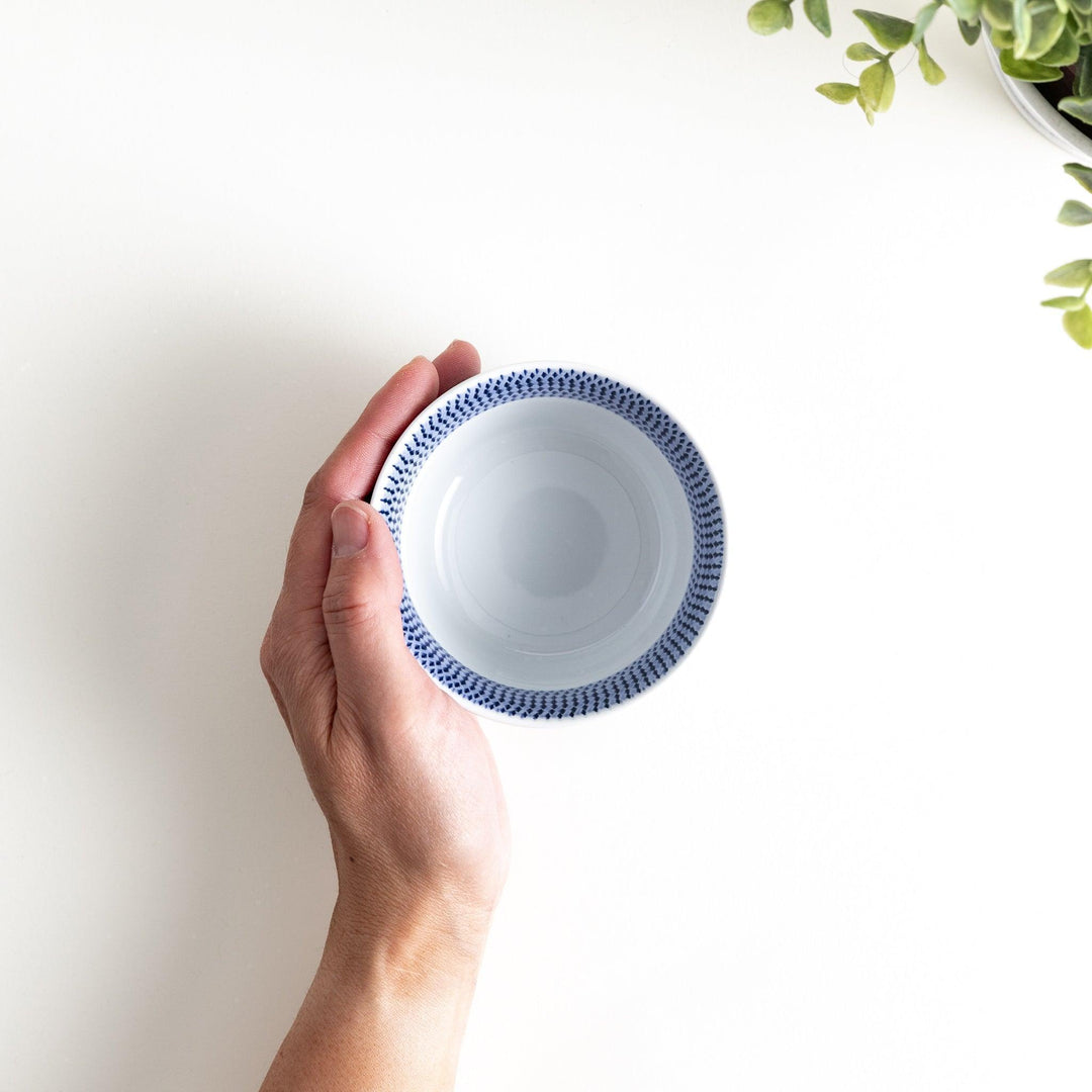 Japanese porcelain dessert bowl with delicate vertical line pattern and smooth gradient design for modern, everyday dining