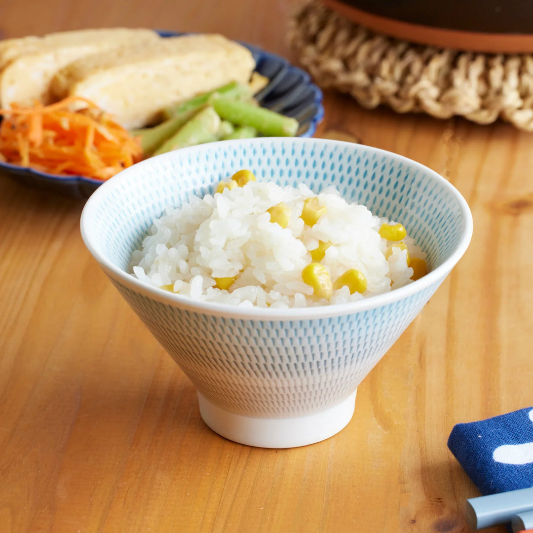 Japanese rice bowl with donabe cooked corn rice served with side dishes for warm everyday dining.