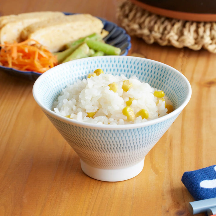 Japanese rice bowl with donabe cooked corn rice served with side dishes for warm everyday dining.