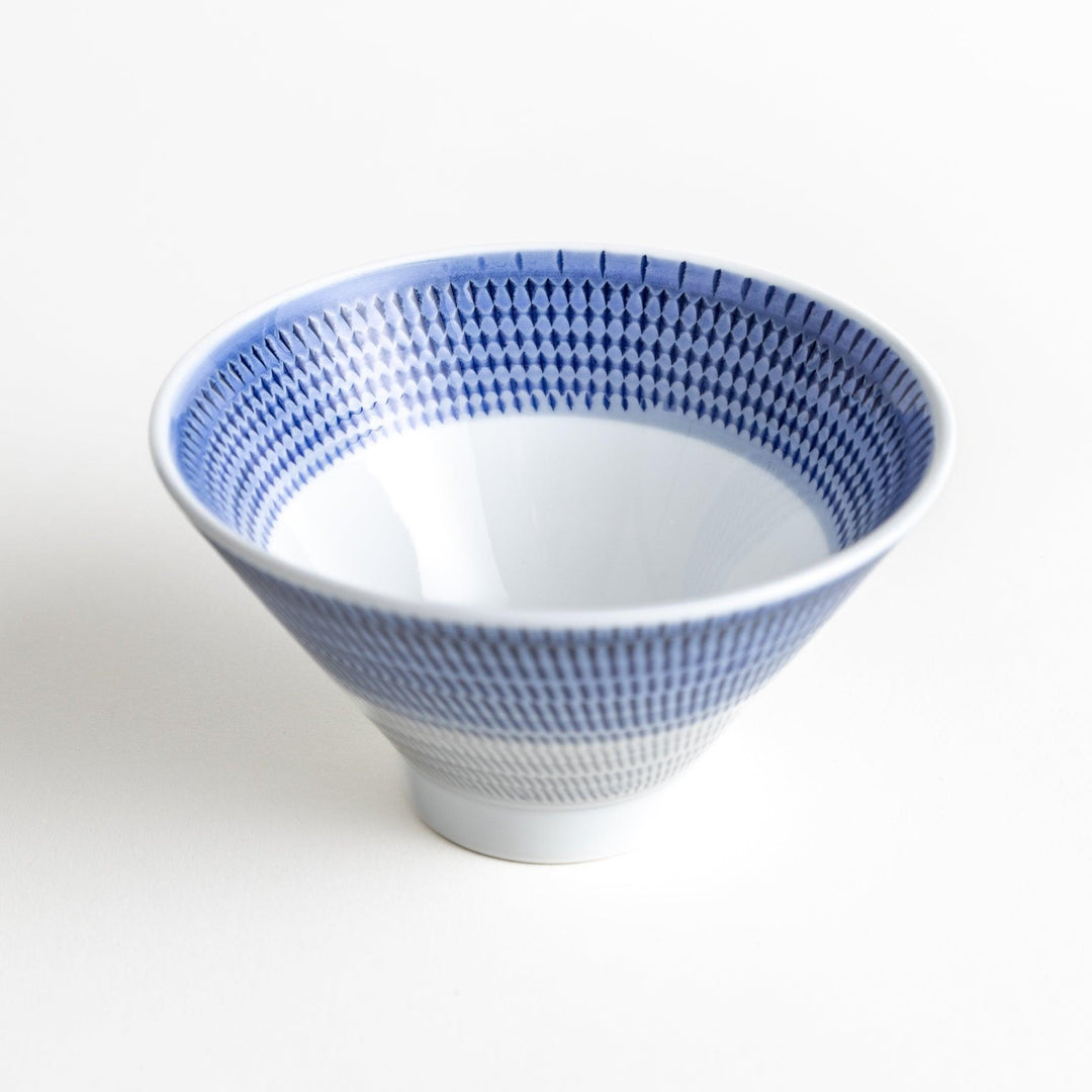 Colorful rice bowls with a gradient texture in various shades including green, blue, red, and brown.