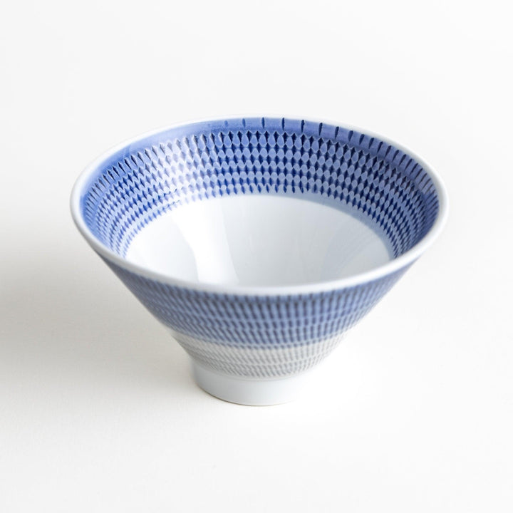 Colorful rice bowls with a gradient texture in various shades including green, blue, red, and brown.