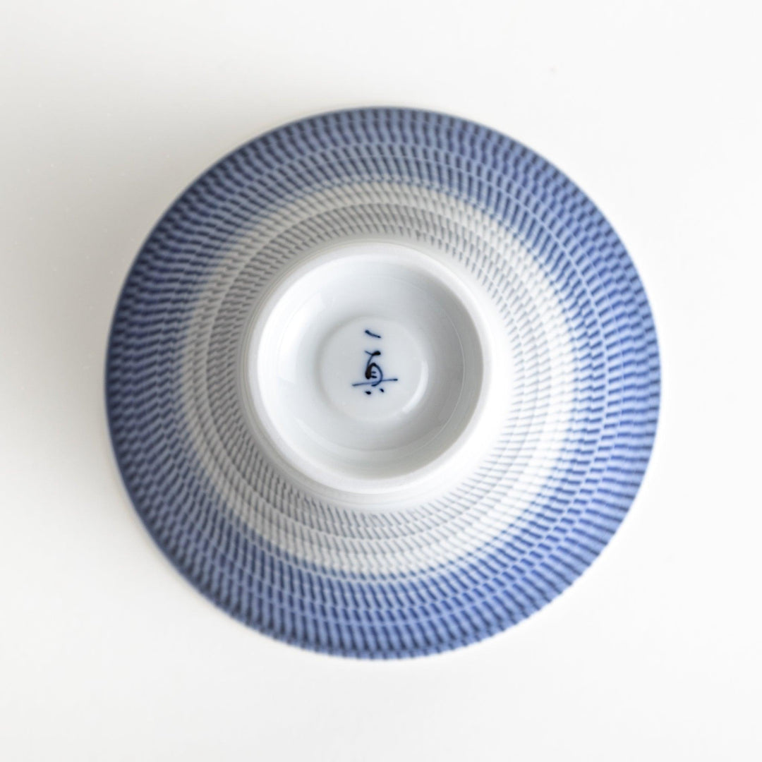 Colorful rice bowls with a gradient texture in various shades including green, blue, red, and brown.