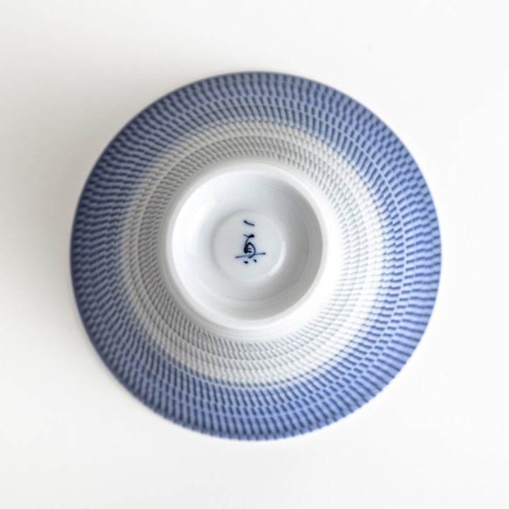 Colorful rice bowls with a gradient texture in various shades including green, blue, red, and brown.