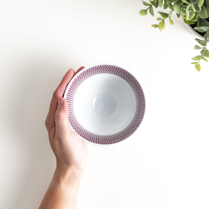 Colorful rice bowls with a gradient texture in various shades including green, blue, red, and brown.