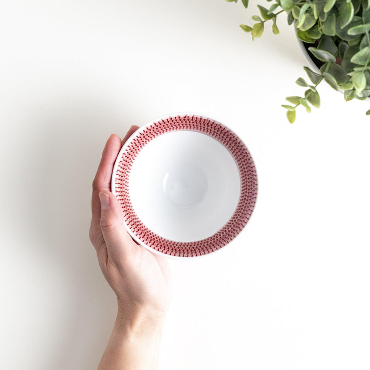 Colorful rice bowls with a gradient texture in various shades including green, blue, red, and brown.