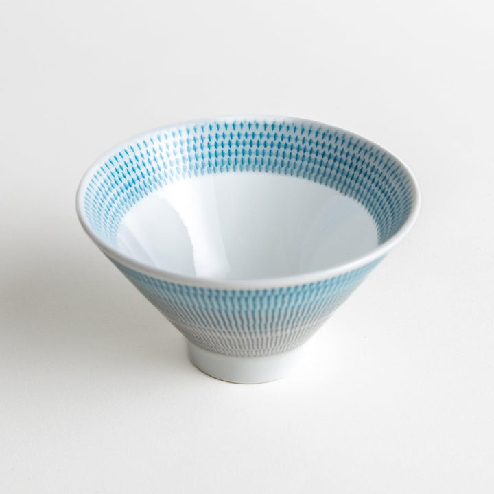 Colorful rice bowls with a gradient texture in various shades including green, blue, red, and brown.