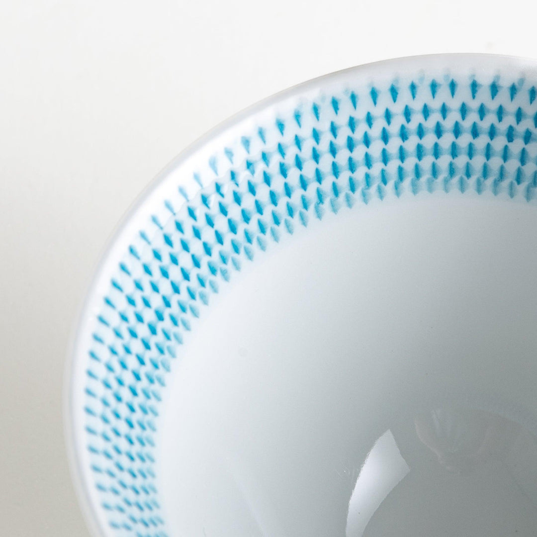 Colorful rice bowls with a gradient texture in various shades including green, blue, red, and brown.