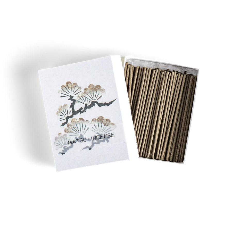 Incense with brown sticks in a pine tree design box offering a fresh woody fragrance reminiscent of evergreen forests.