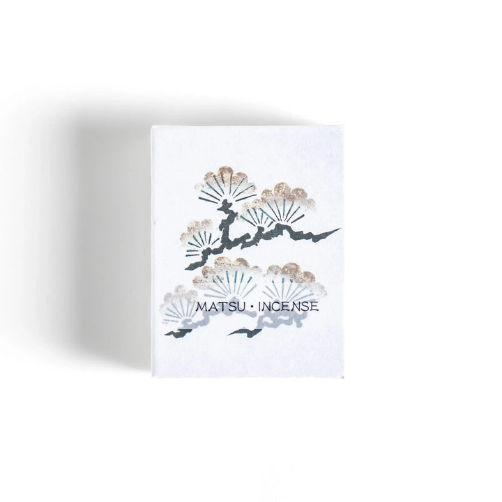 Incense with brown sticks in a pine tree design box offering a fresh woody fragrance reminiscent of evergreen forests.
