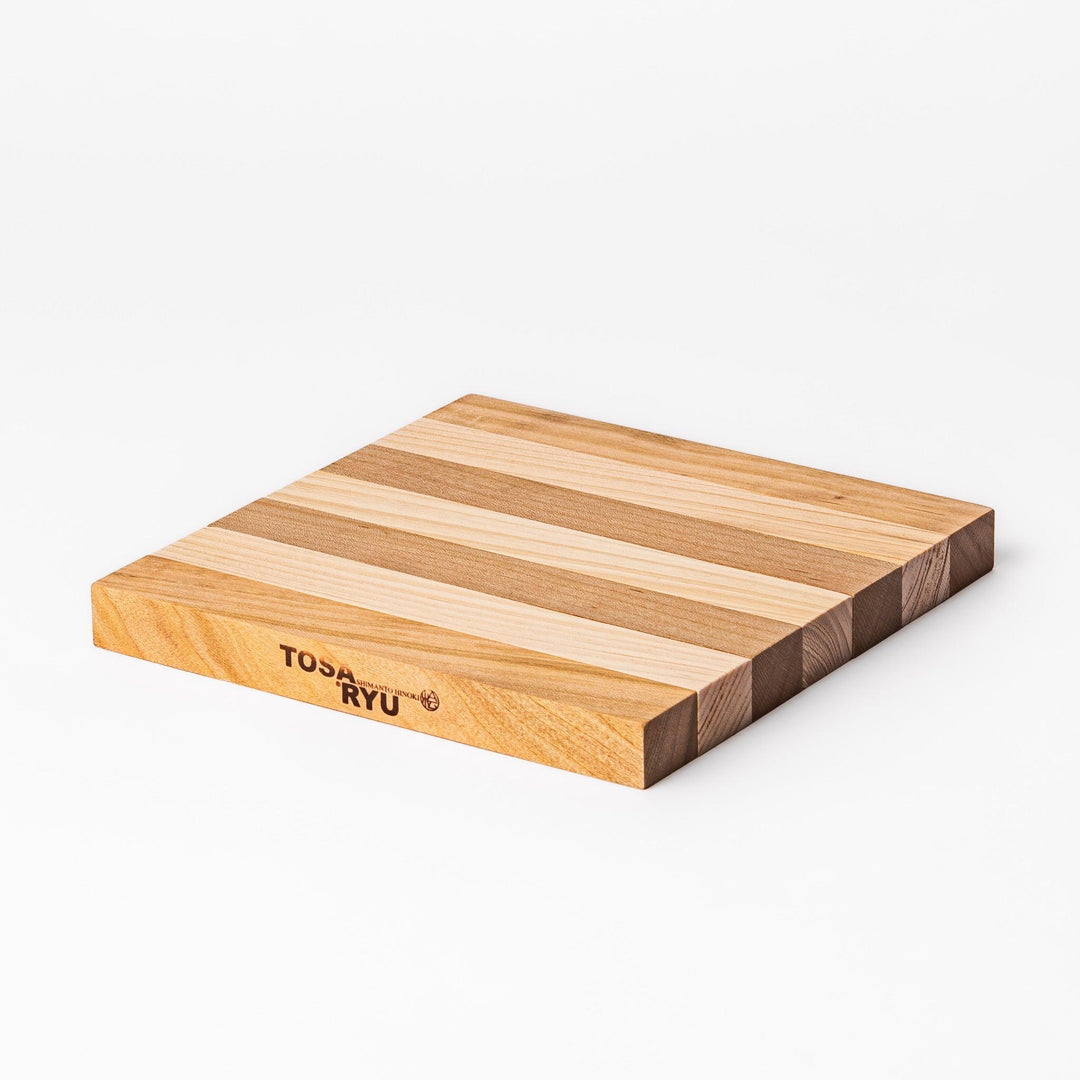 Expandable hinoki and cherry wood trivet with slats fanned out, showing mixed wood tones for versatile pot support