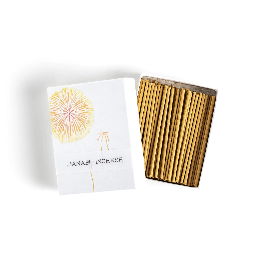 Golden incense sticks in fireworks motif box offering a bright uplifting fragrance for festive occasions.