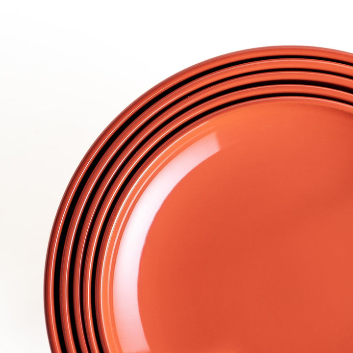 Set of five nested lacquer bowls used in Japanese oryoki meals representing minimalism mindfulness in black or red.