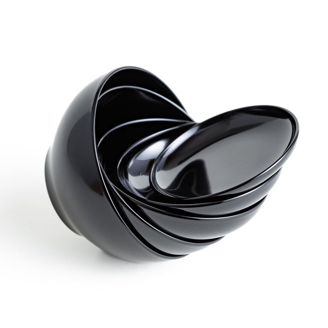Set of five nested lacquer bowls used in Japanese oryoki meals representing minimalism mindfulness in black or red.