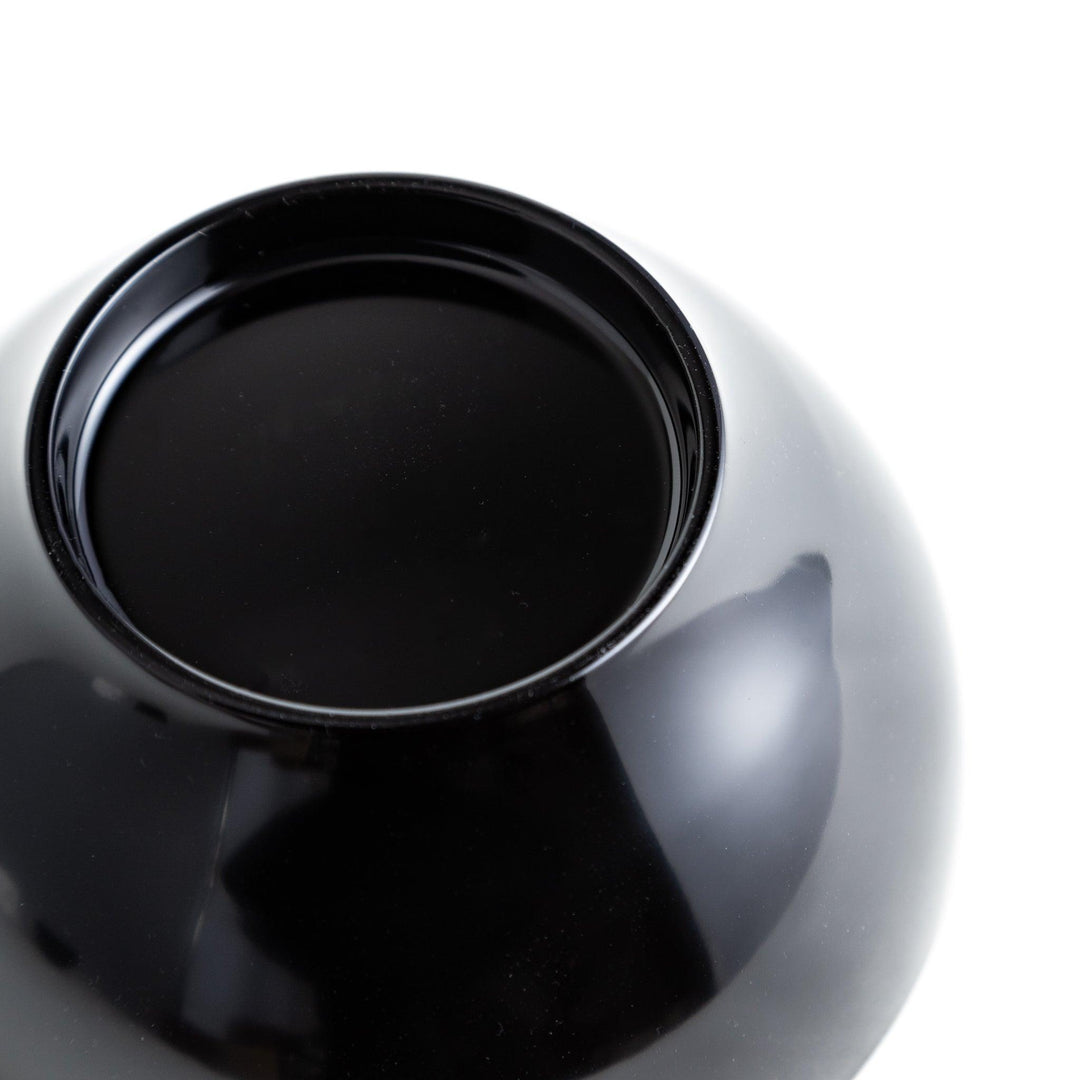 Set of five nested lacquer bowls used in Japanese oryoki meals representing minimalism mindfulness in black or red.