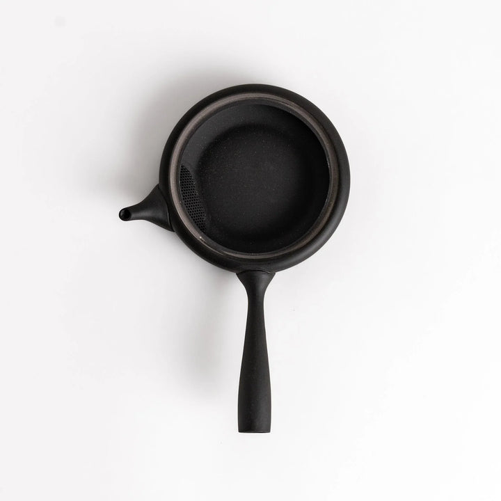 Sleek black teapot with flat body and side handle offering minimalist design for elegant Japanese tea.