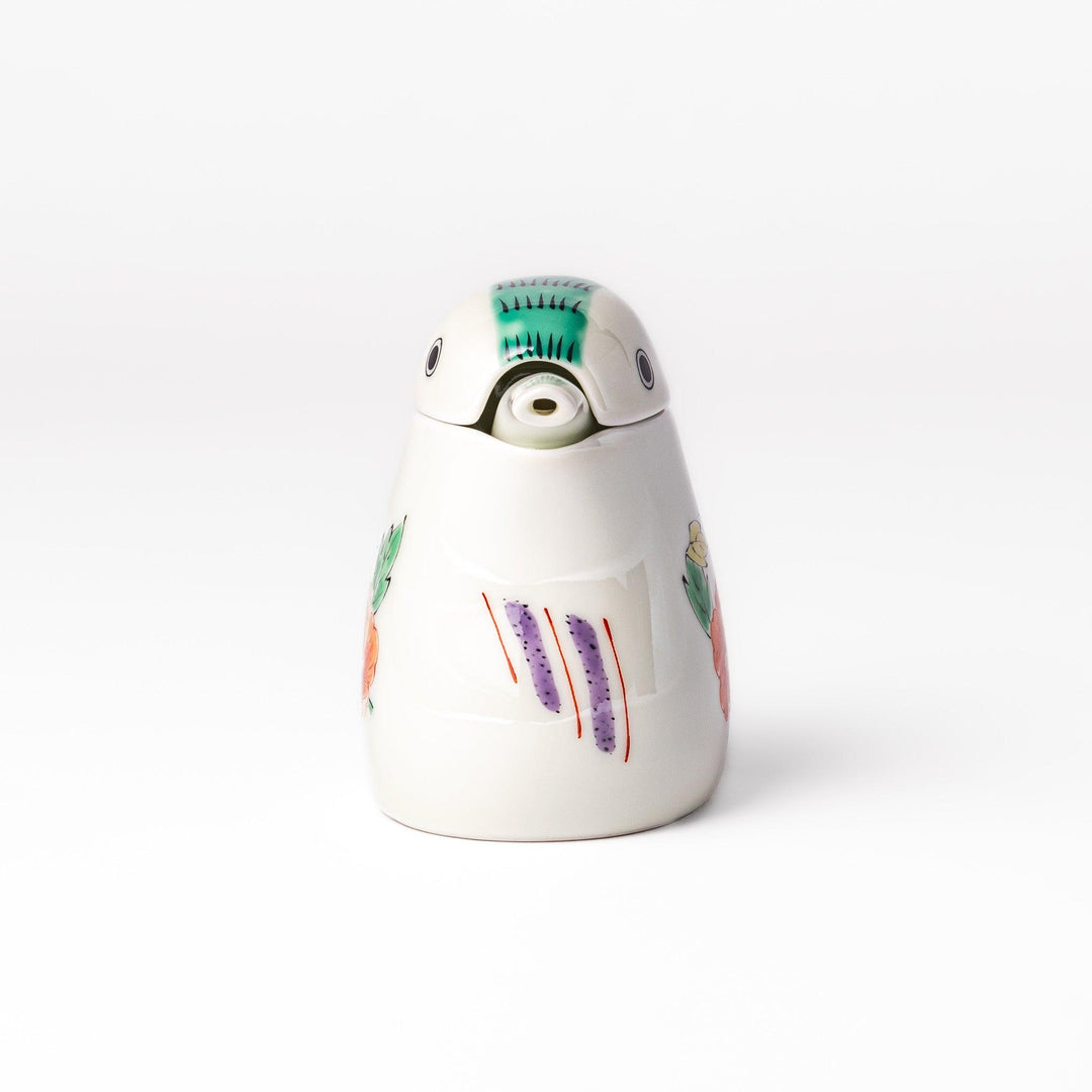 A bird-shaped soy sauce dispenser featuring a traditional floral design in red, green, and orange.
