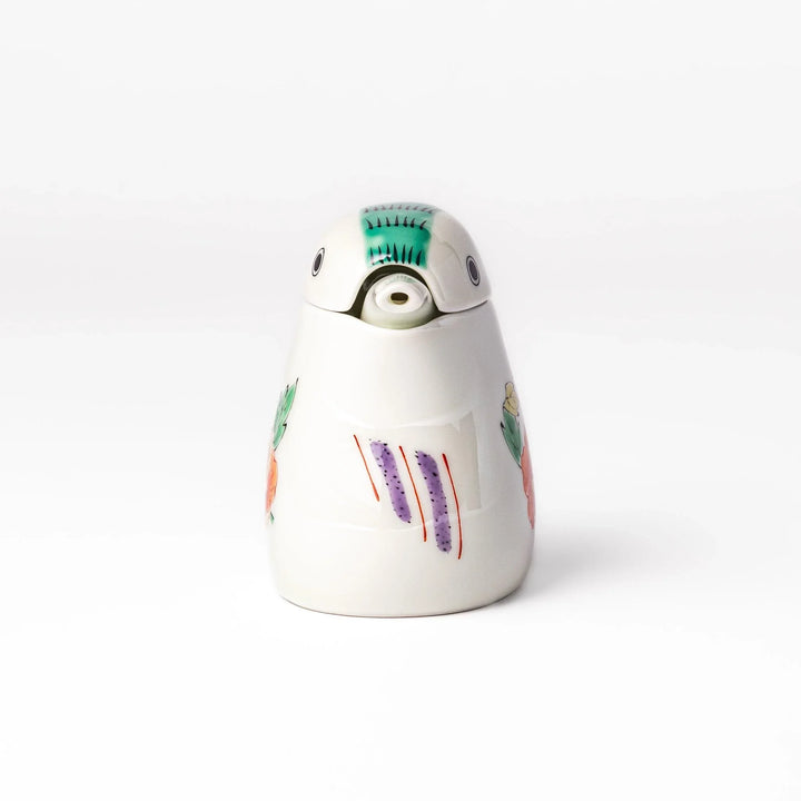A bird-shaped soy sauce dispenser featuring a traditional floral design in red, green, and orange.