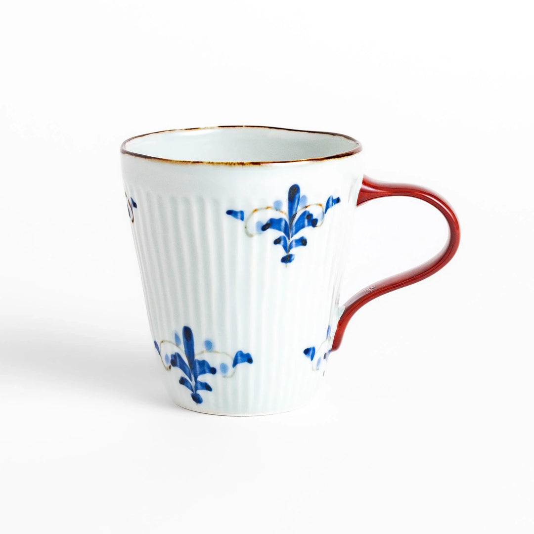 Floral Leaves mug with red handle, detailed blue floral motifs, and gold trim for an elegant tea experience.