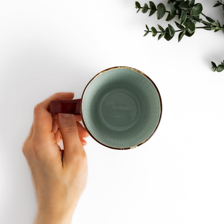 Floral Leaves mug with red handle, detailed blue floral motifs, and gold trim for an elegant tea experience.