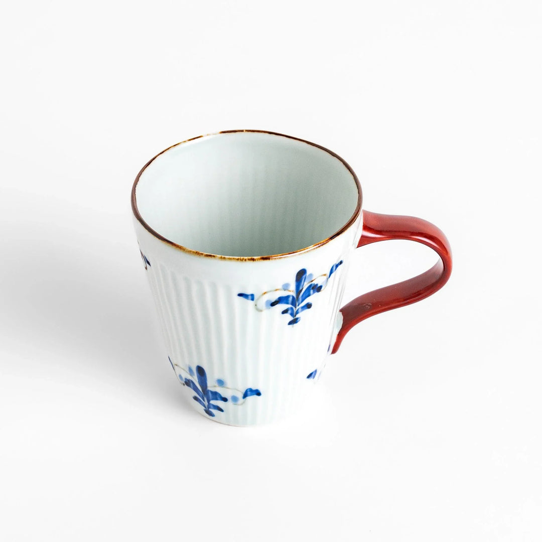 Floral Leaves mug with red handle, detailed blue floral motifs, and gold trim for an elegant tea experience.