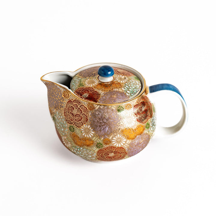 Ceramic teapot with floral pattern in gold and pastels classic design ideal for brewing Japanese tea.