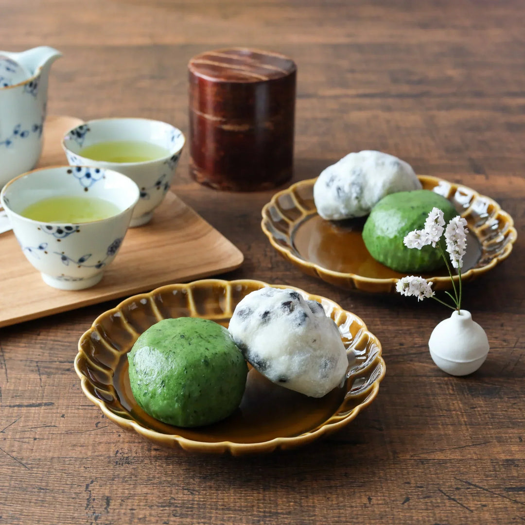 Amber flower petal dessert plates with Japanese sweets floral teacups and cherry bark tea caddy.