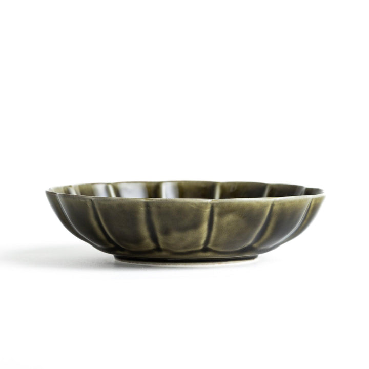 Cereal bowl with scalloped edges and a glossy dark brown or olive finish.