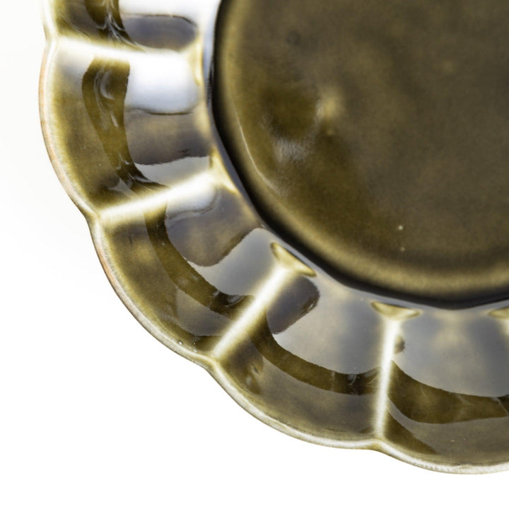 Cereal bowl with scalloped edges and a glossy dark brown or olive finish.