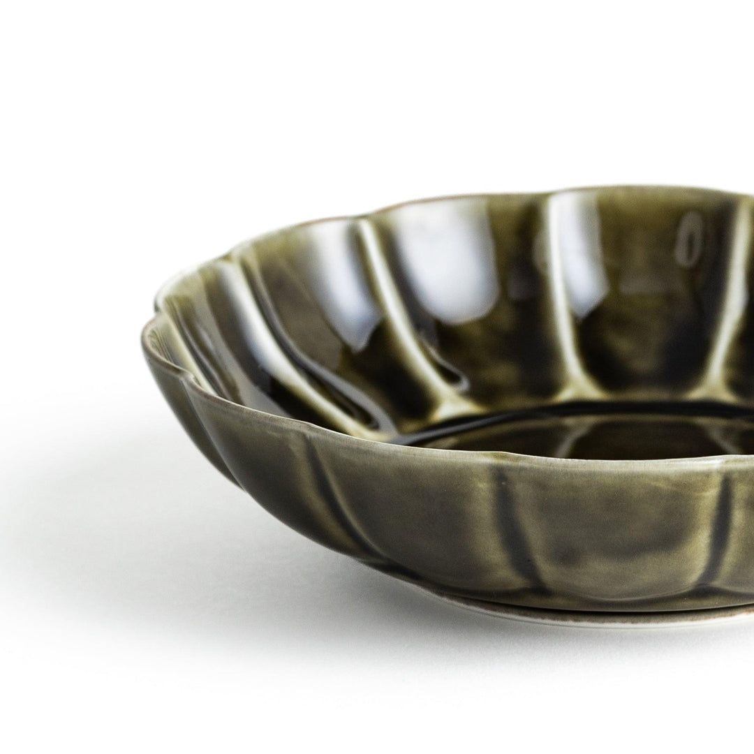 Cereal bowl with scalloped edges and a glossy dark brown or olive finish.