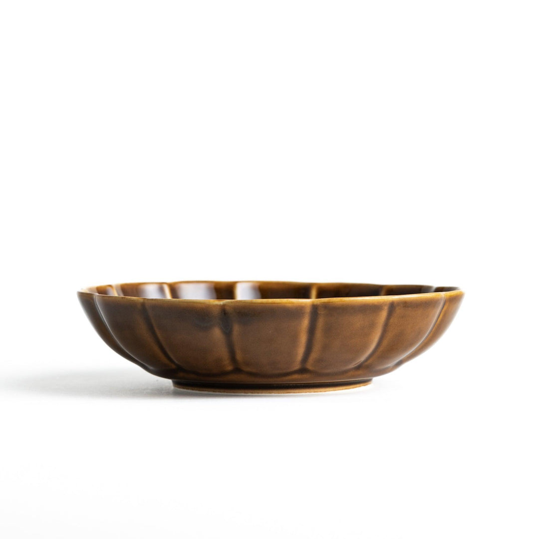 Cereal bowl with scalloped edges and a glossy dark brown or olive finish.