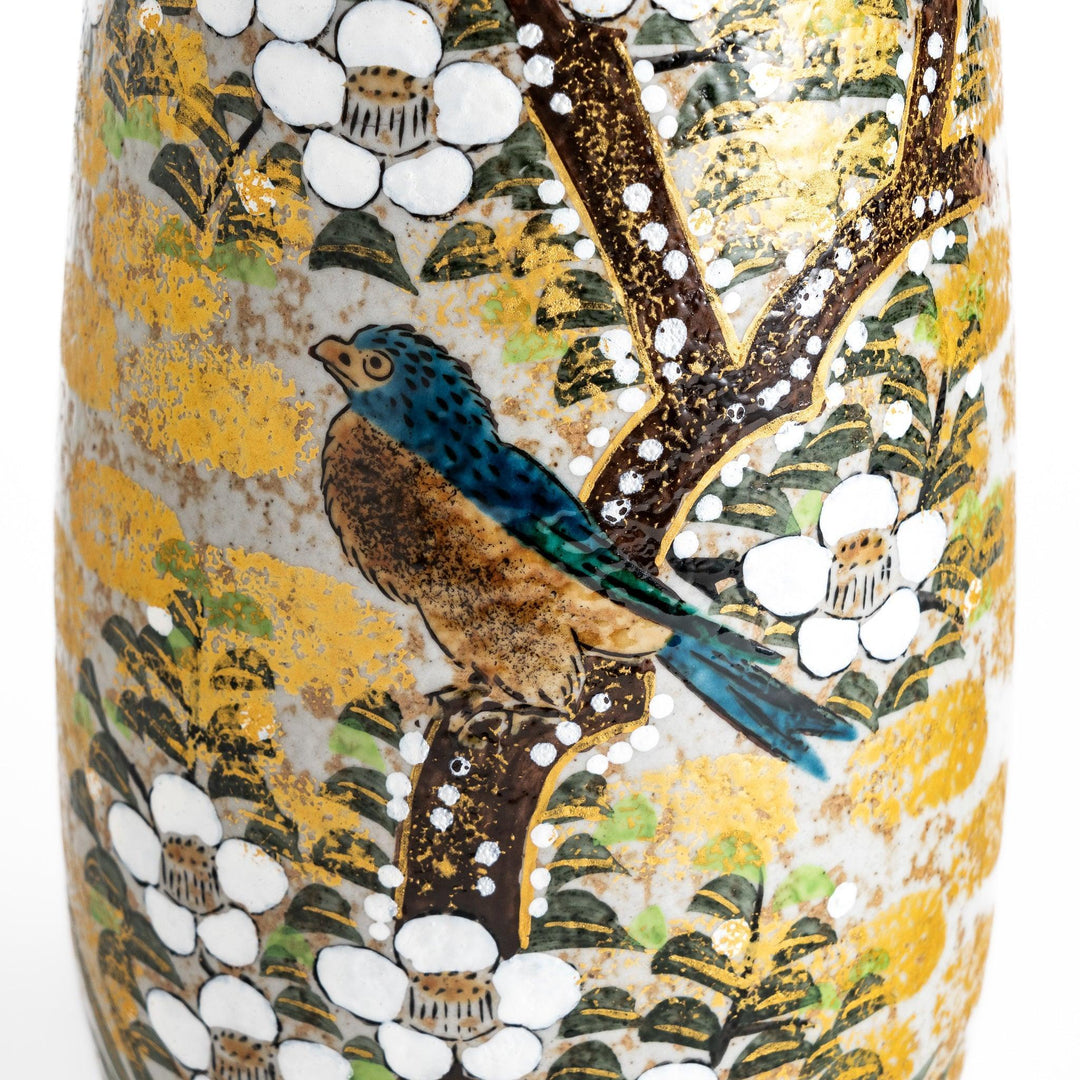 Flower vase with hand painted blooms and perched bird in warm gold and green tones for refined display.