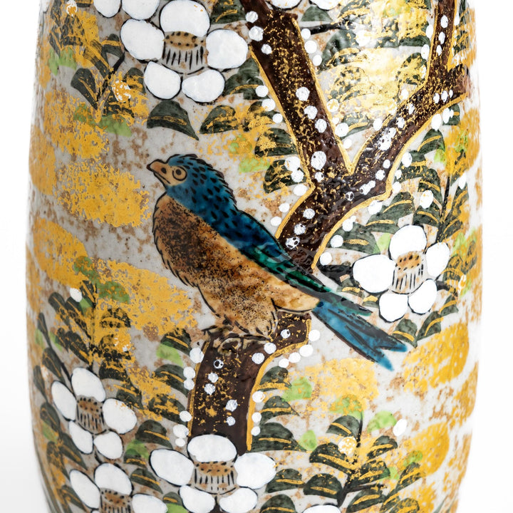 Flower vase with hand painted blooms and perched bird in warm gold and green tones for refined display.