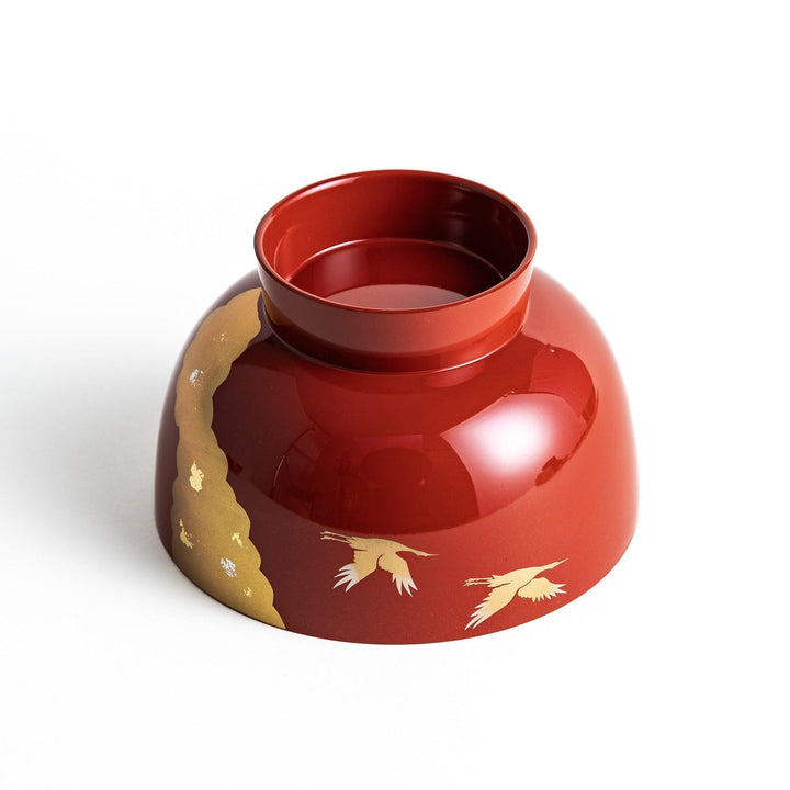 A lacquered soup bowl with a gold-painted cloud and crane motif. Available in red or black.