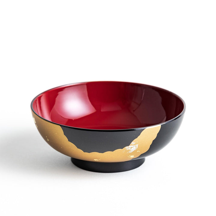 A lacquered soup bowl with a gold-painted cloud and crane motif. Available in red or black.
