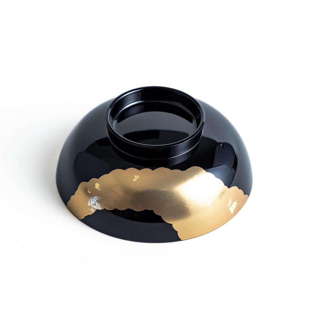 A lacquered soup bowl with a gold-painted cloud and crane motif. Available in red or black.