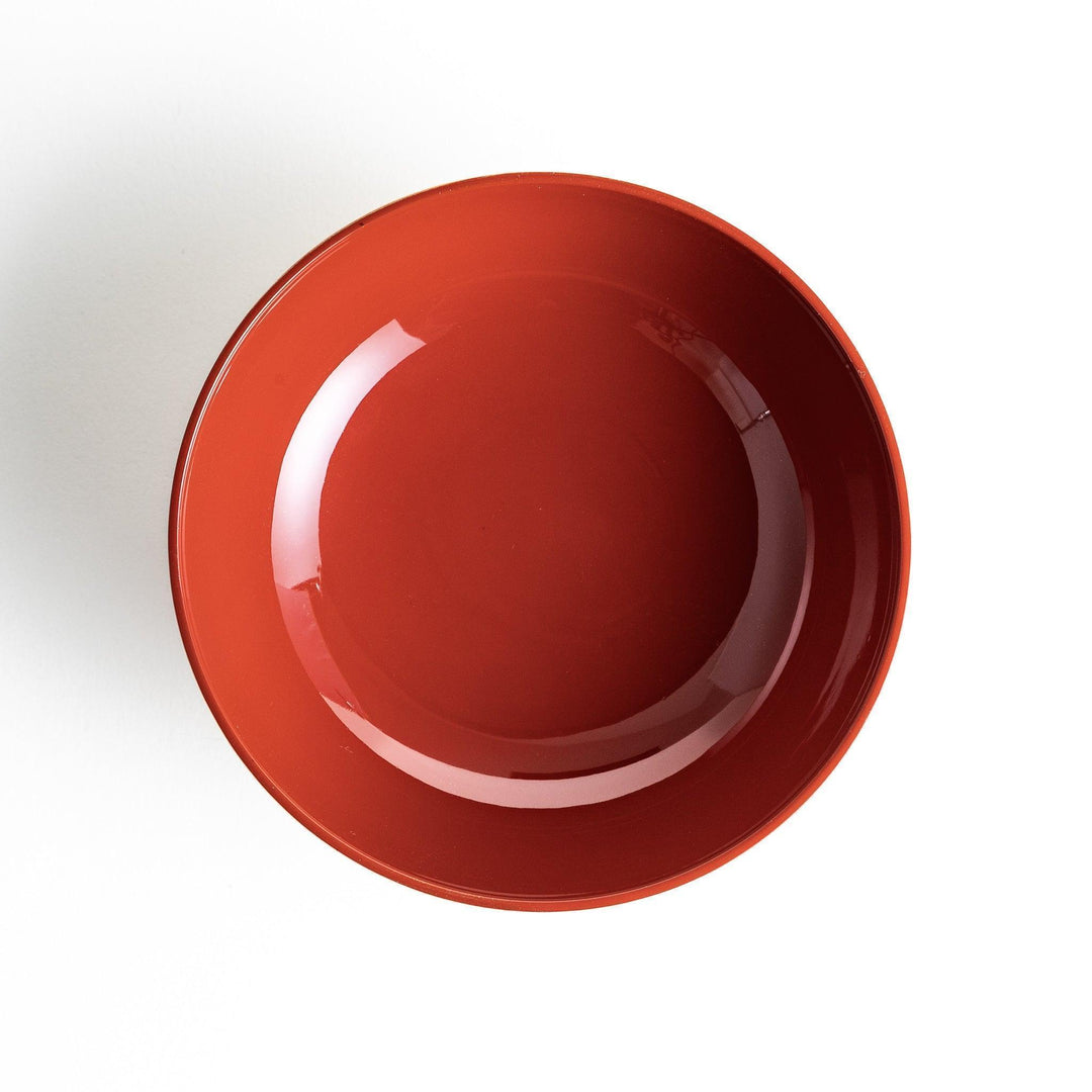 A lacquered soup bowl with a gold-painted cloud and crane motif. Available in red or black.