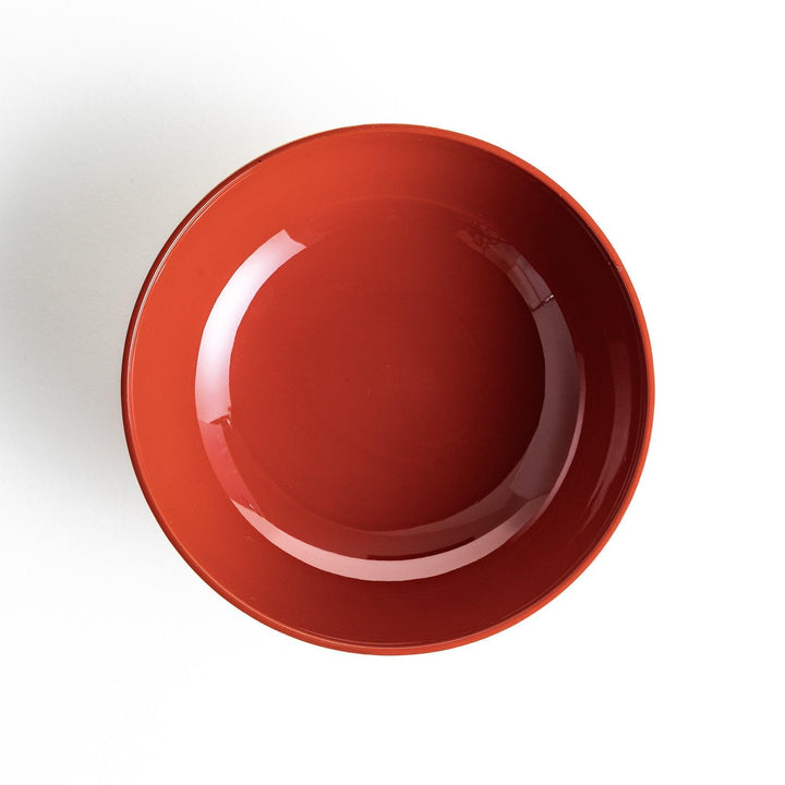 A lacquered soup bowl with a gold-painted cloud and crane motif. Available in red or black.