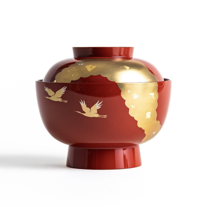 A lacquered soup bowl with a gold-painted cloud and crane motif. Available in red or black.
