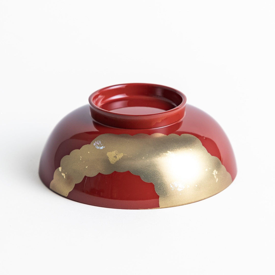 A lacquered soup bowl with a gold-painted cloud and crane motif. Available in red or black.