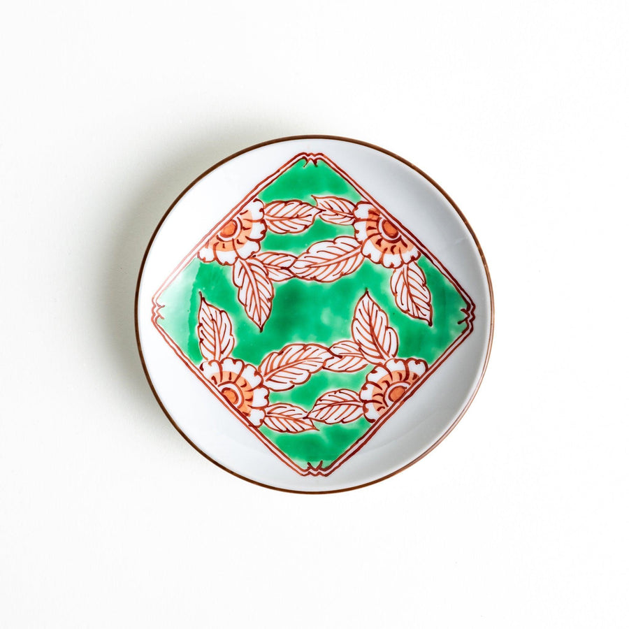 Round plate with green Mt. Fuji pattern and orange floral design.