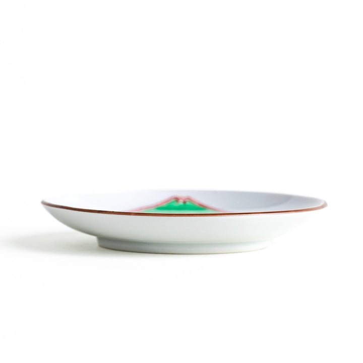 Round plate with green Mt. Fuji pattern and orange floral design.