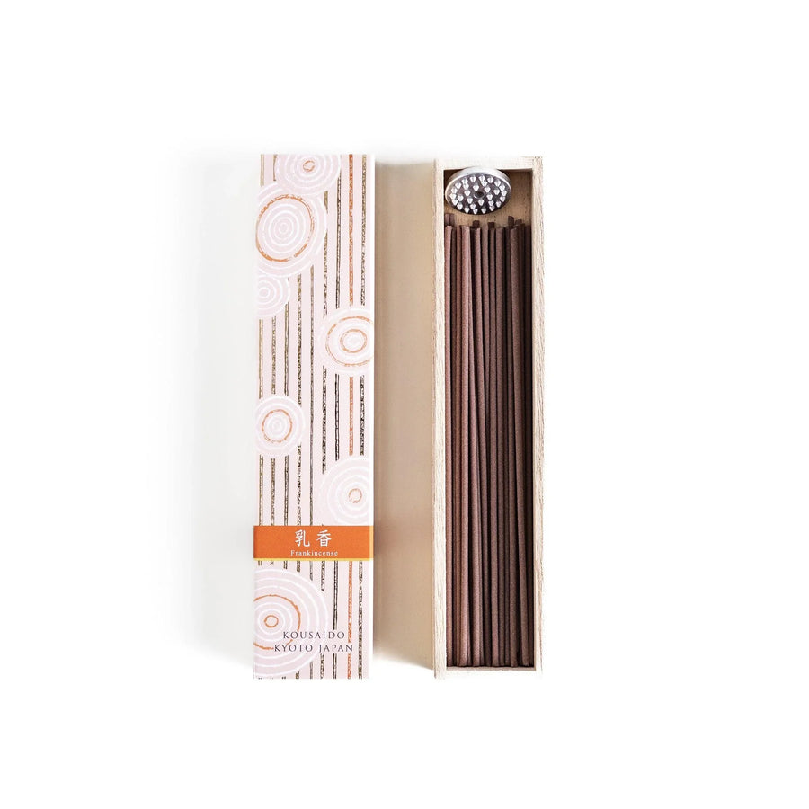Japanese frankincense incense sticks in a wooden box with an orange patterned sleeve from Kyoto’s Kousaido