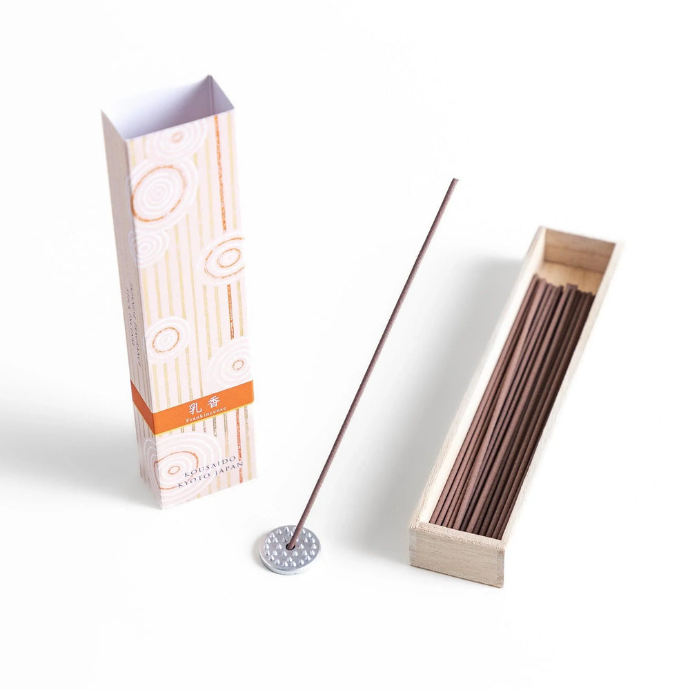 Japanese frankincense incense sticks in a wooden box with an orange patterned sleeve from Kyoto’s Kousaido