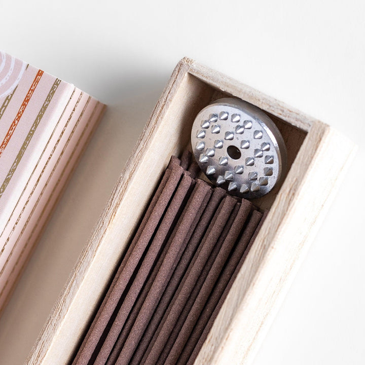 Japanese frankincense incense sticks in a wooden box with an orange patterned sleeve from Kyoto’s Kousaido