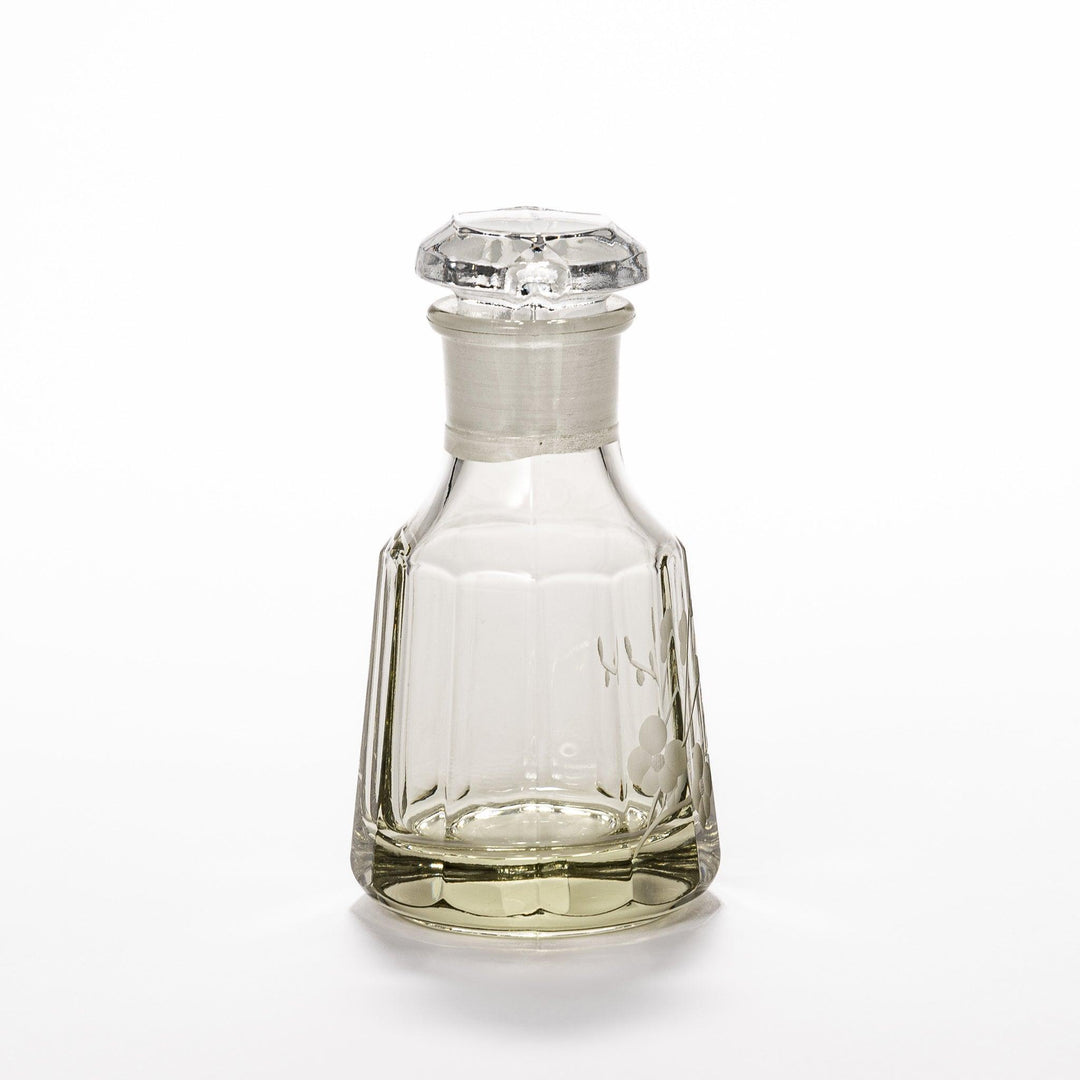 Soy sauce dispenser with frosted plum blossom design and smooth pour spout, featuring a geometric base.