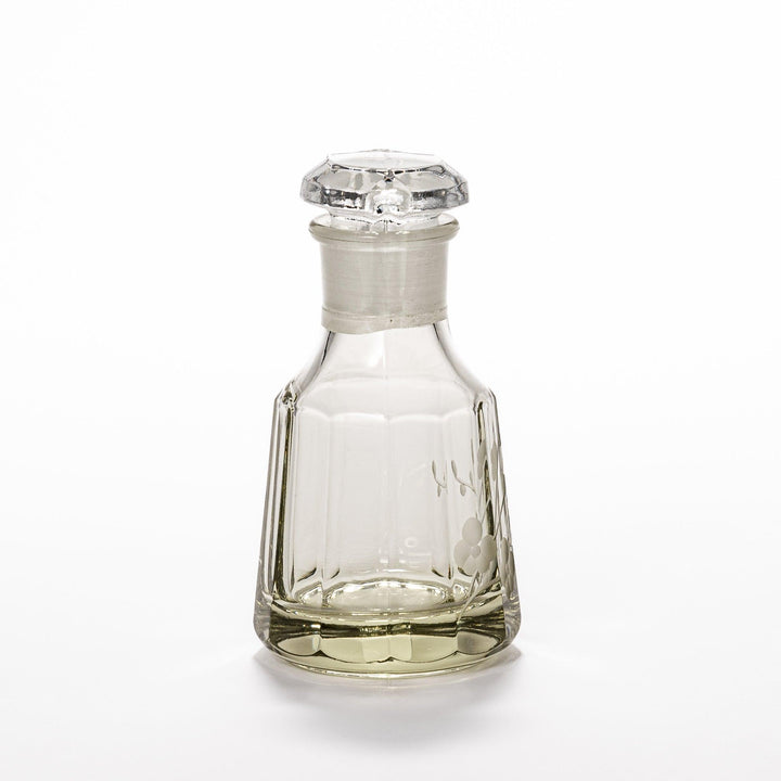 Soy sauce dispenser with frosted plum blossom design and smooth pour spout, featuring a geometric base.