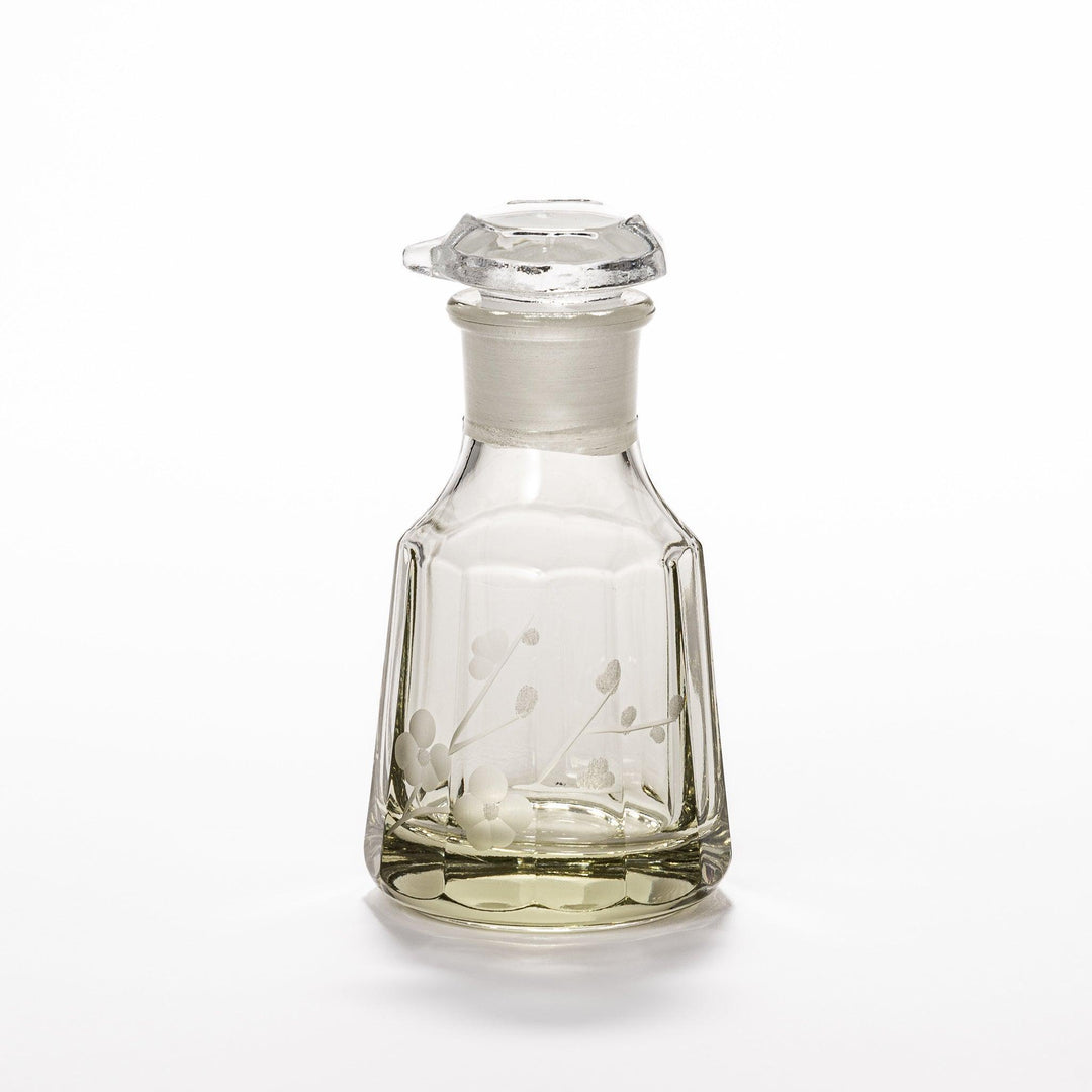 Soy sauce dispenser with frosted plum blossom design and smooth pour spout, featuring a geometric base.