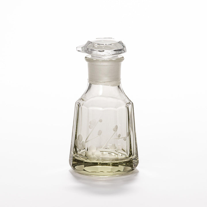 Soy sauce dispenser with frosted plum blossom design and smooth pour spout, featuring a geometric base.